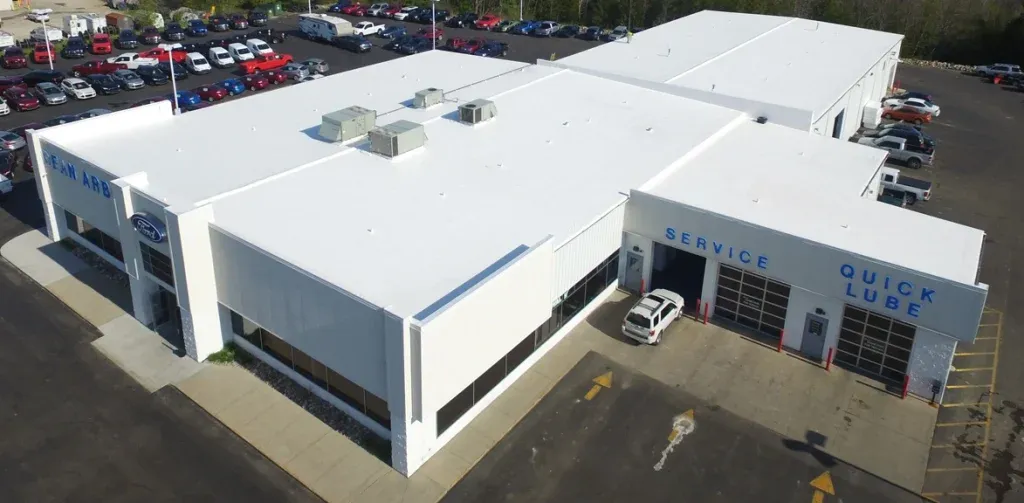 Finished roof for Ford dealership. Flat roof replacement for retail businesses.