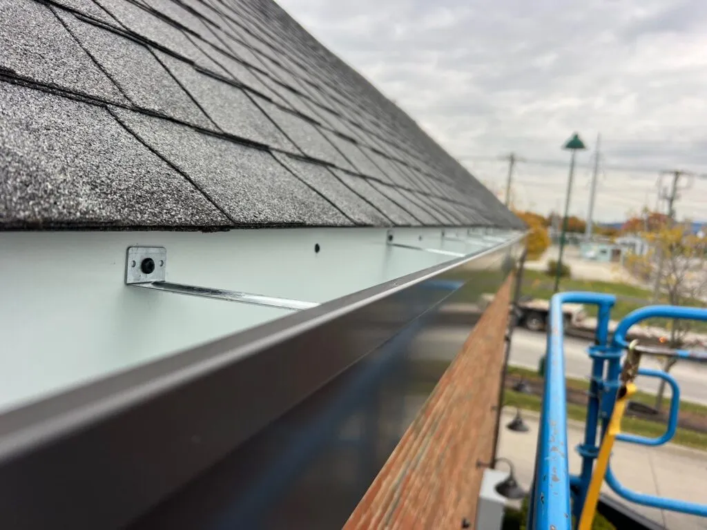 custom box gutters on restaurant showing metal support bracket